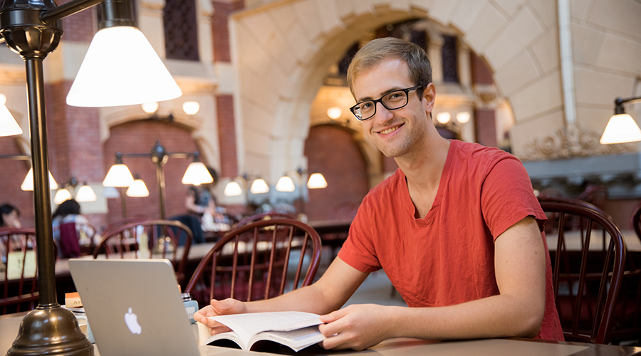 Post-Baccalaureate Studies student studying in library