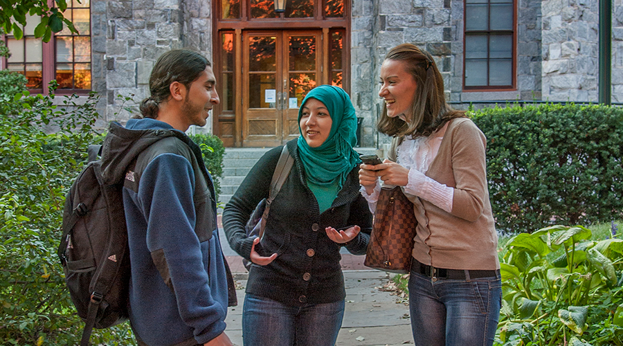 International Penn students chatting on campus